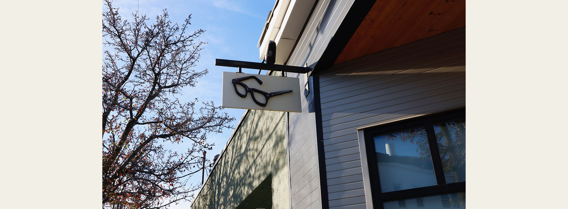 The image shows a building with a sign that reads  Six  on the side, set against a clear sky.